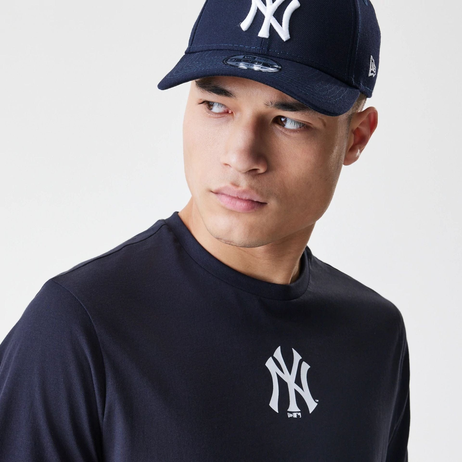 The Male model is wearing New York Yankees MLB Logo Navy T-Shirt 4