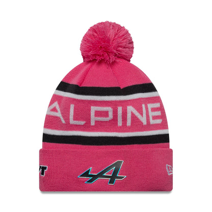 New Era Alpine Racing Youth Replica Jack Doohan Pink Cuff Knit Beanie Hat, front view showing the white and black Alpine lettering on the pink crown, with an embroidered A logo on the cuff and a pom on top.