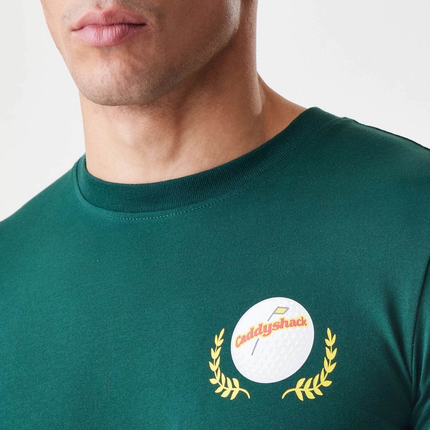 The Male model is wearing Caddyshack It's In The Hole Dark Green T-Shirt 6