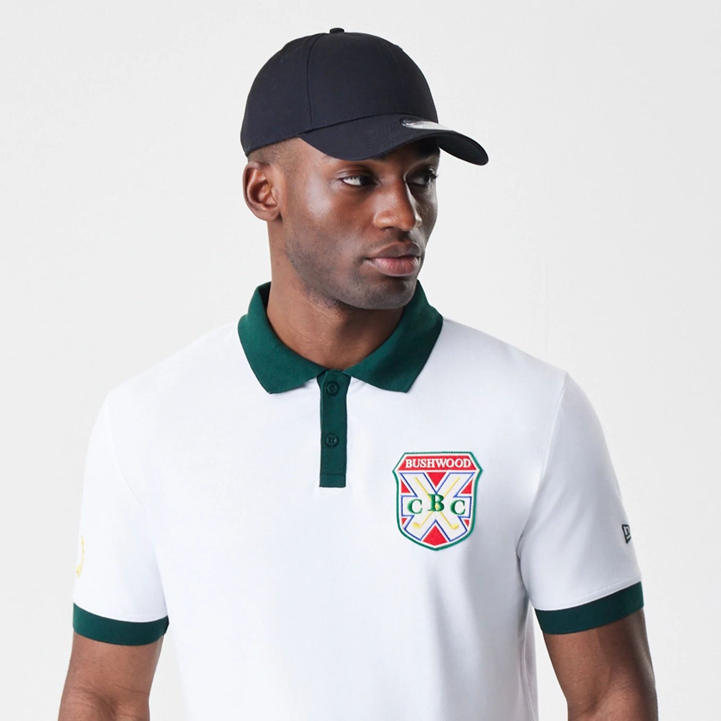 The Male model is wearing Caddyshack BushWood White Polo T-Shirt 6