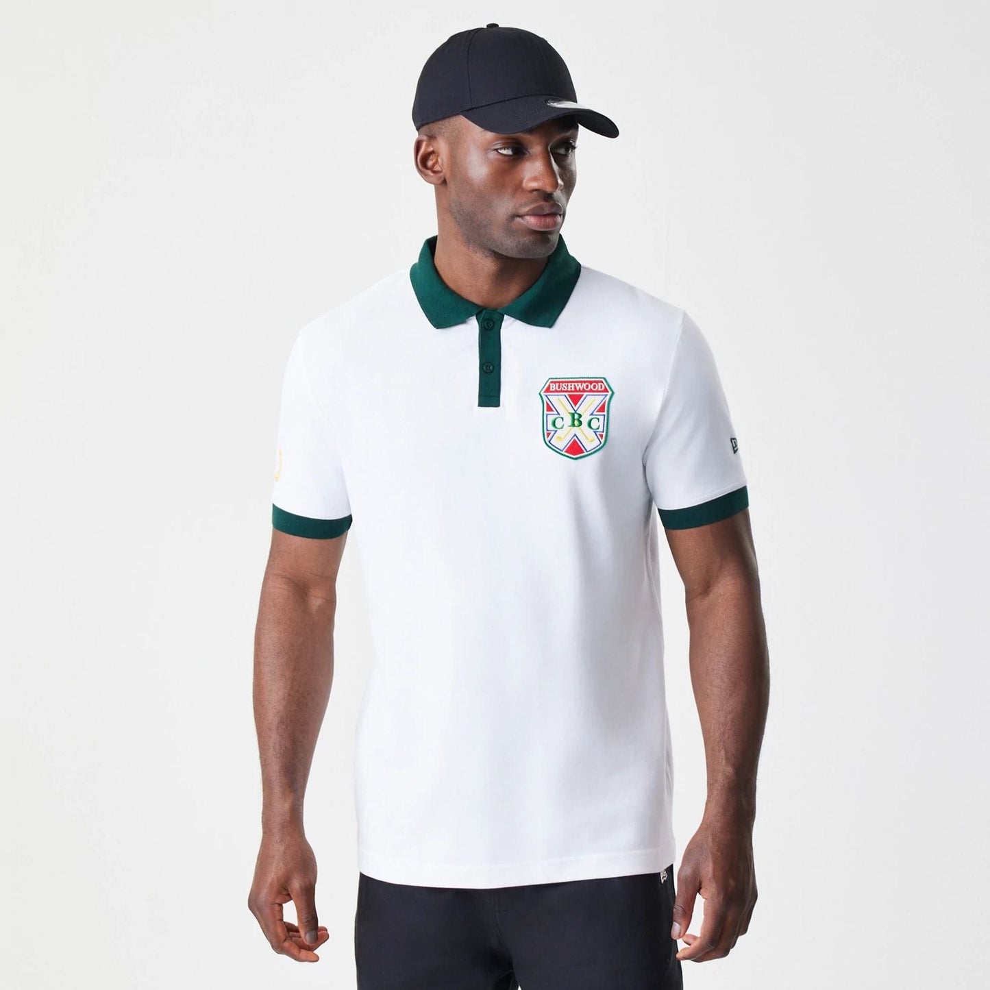 The Male model is wearing Caddyshack BushWood White Polo T-Shirt 1