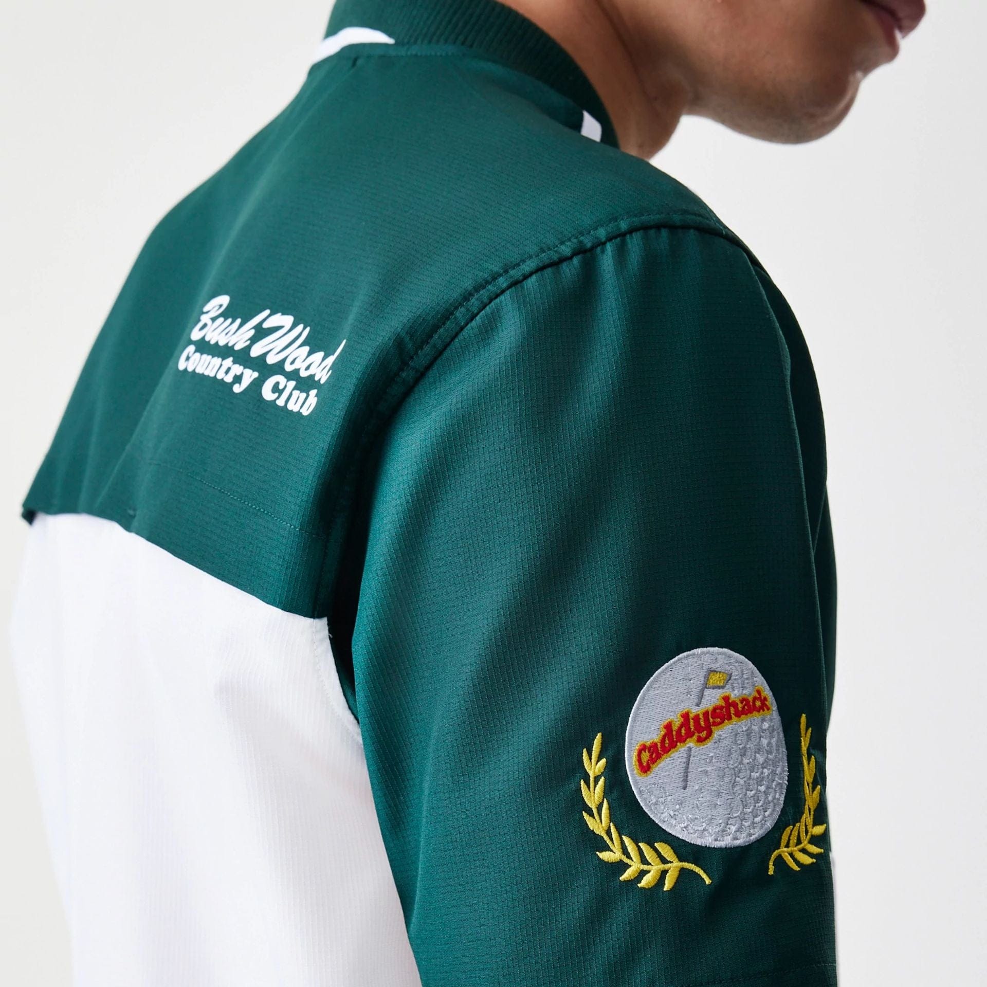 The Male model is wearing Caddyshack BushWood White 1/4 Zip Polo T-Shirt 4