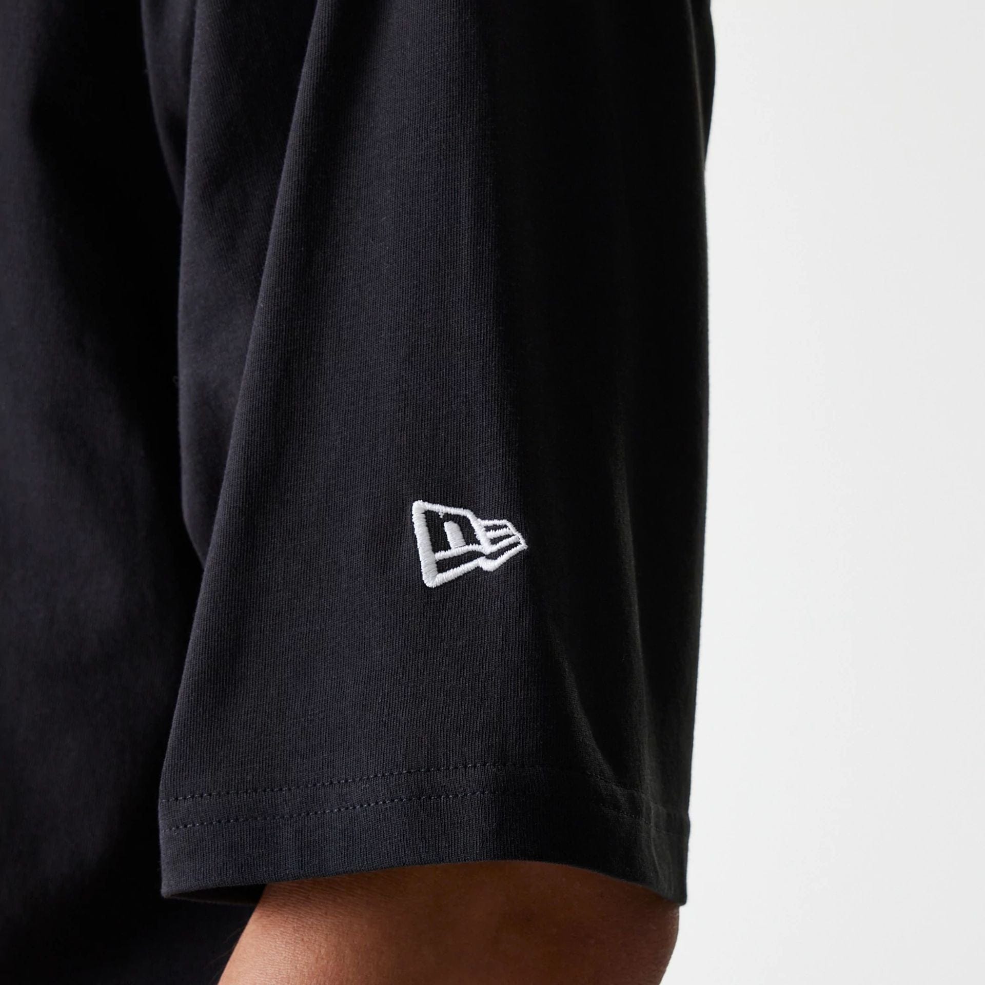 The Male model is wearing New York Yankees MLB League Essential Black Oversized T-Shirt 6