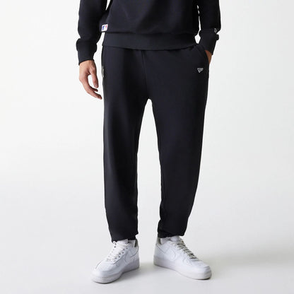 The Male model is wearing New York Yankees MLB League Essential Midi Black Joggers 3