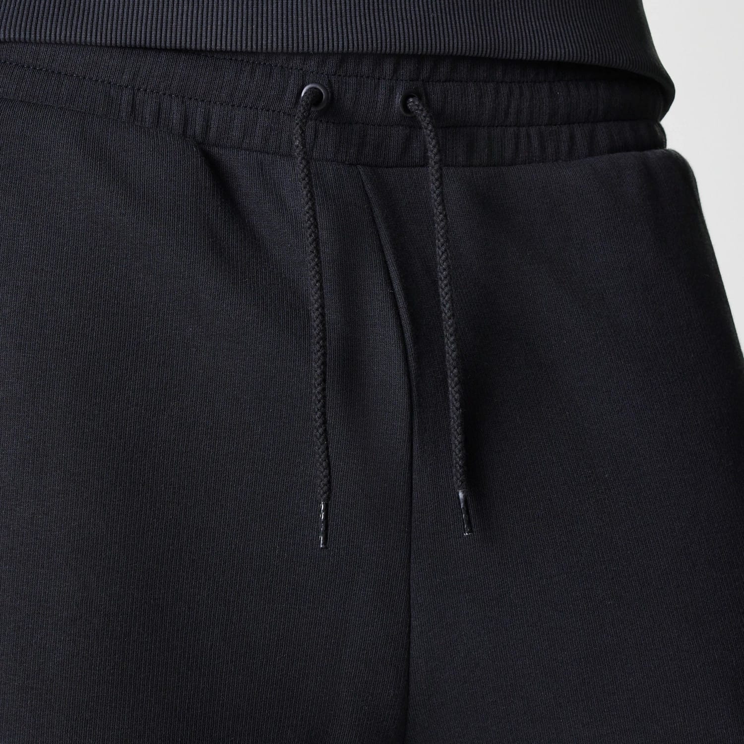 The Male model is wearing New York Yankees MLB League Essential Midi Black Joggers 6