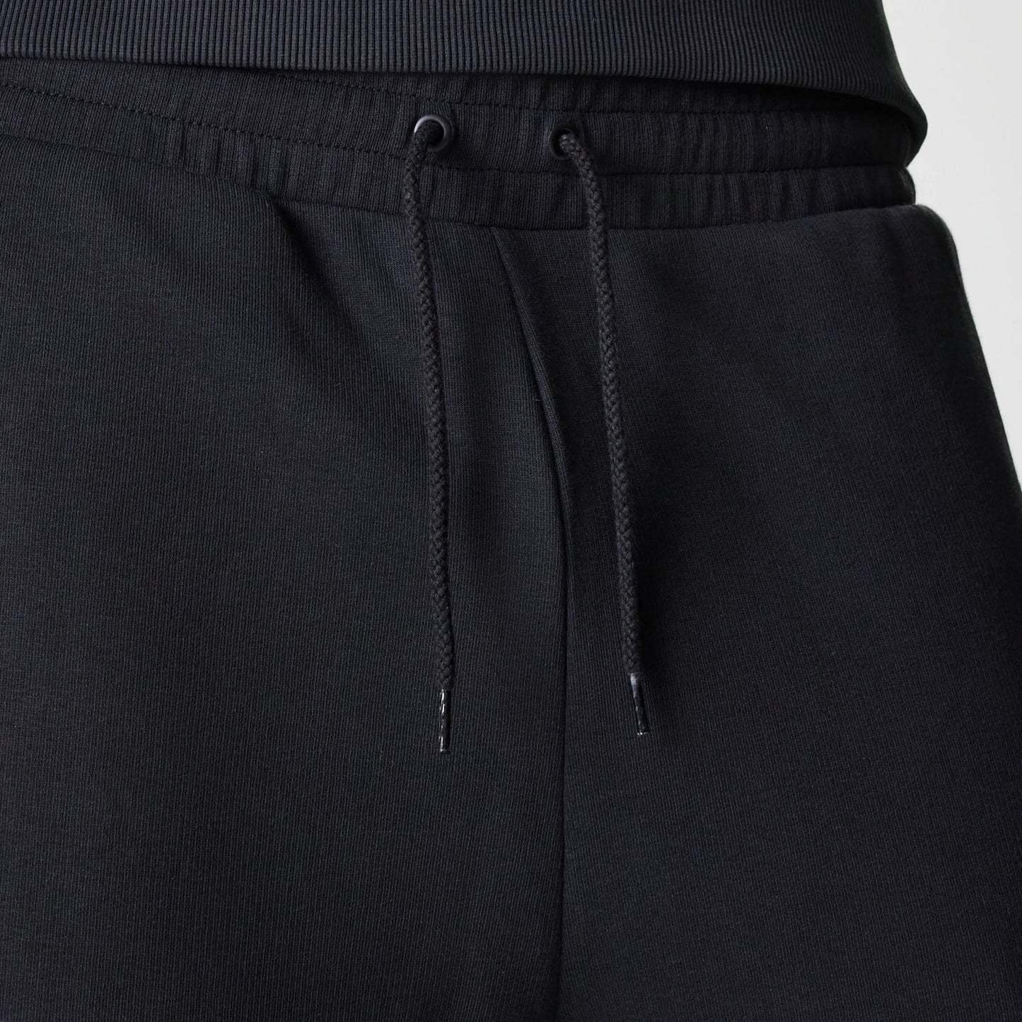 The Male model is wearing New York Yankees MLB League Essential Midi Black Joggers 6