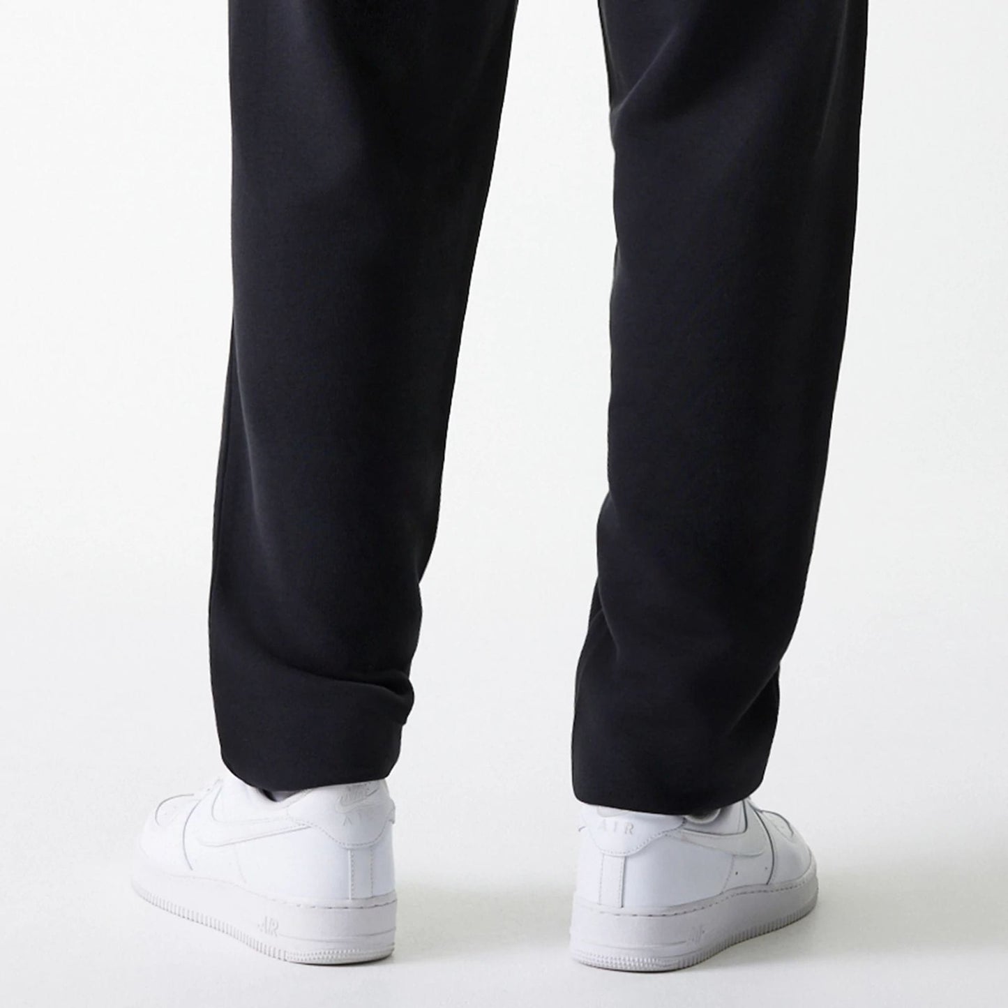 The Male model is wearing New York Yankees MLB League Essential Midi Black Joggers 7