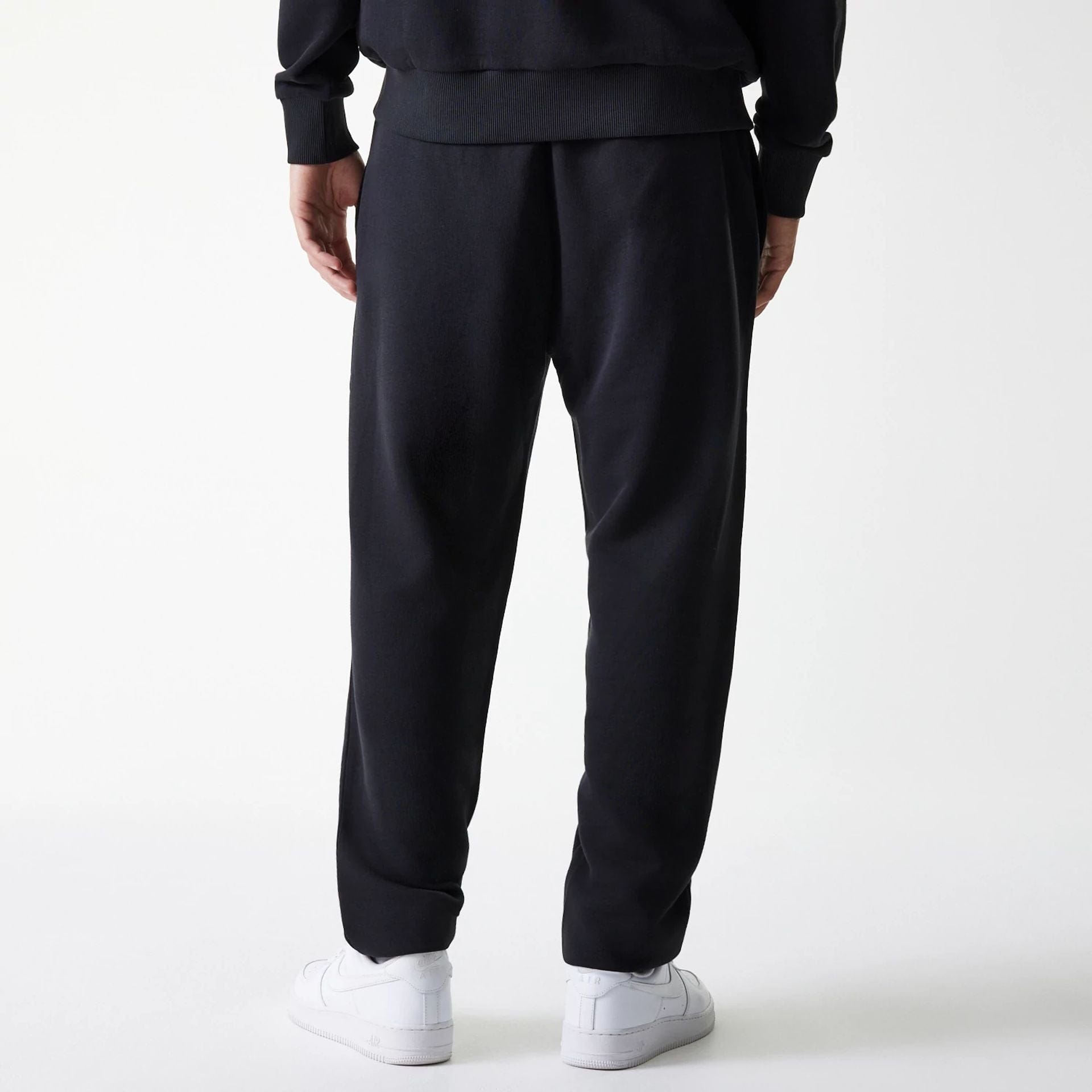 The Male model is wearing New York Yankees MLB League Essential Midi Black Joggers 2