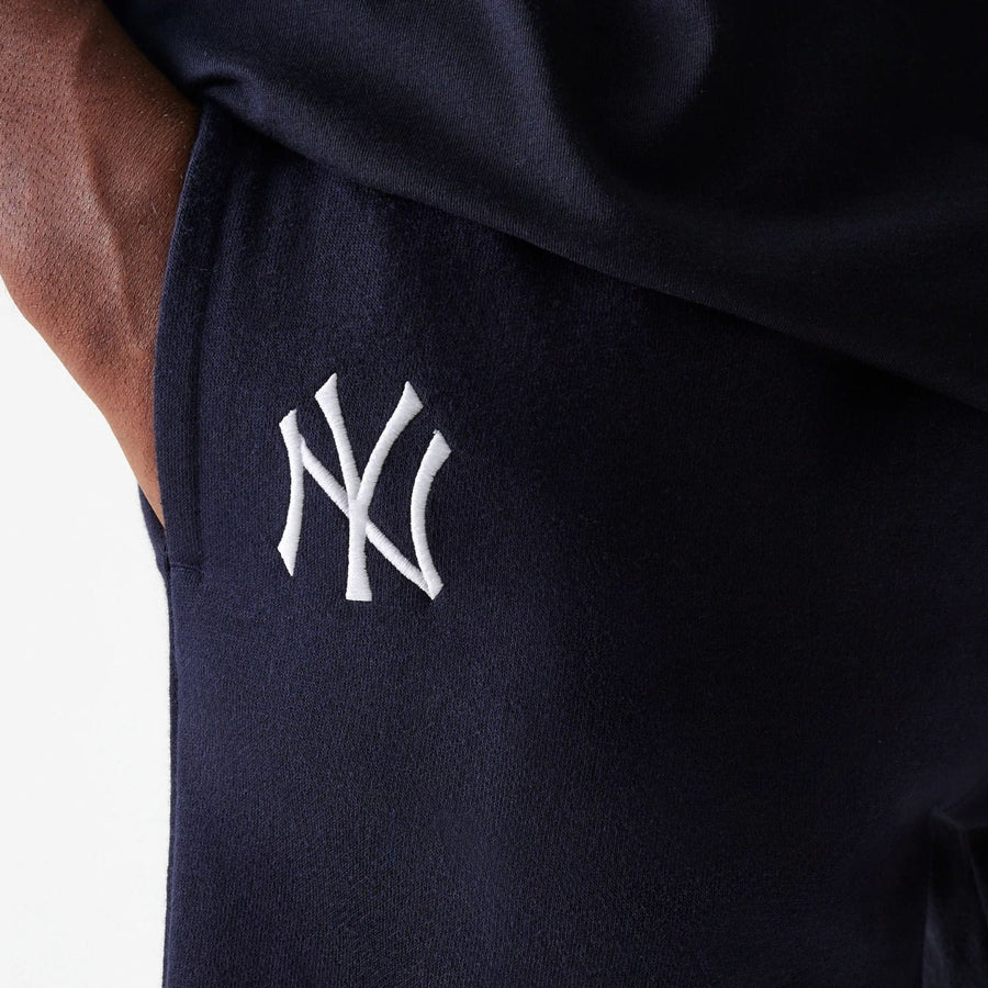 The Male model is wearing New York Yankees MLB League Essential Navy Shorts 4