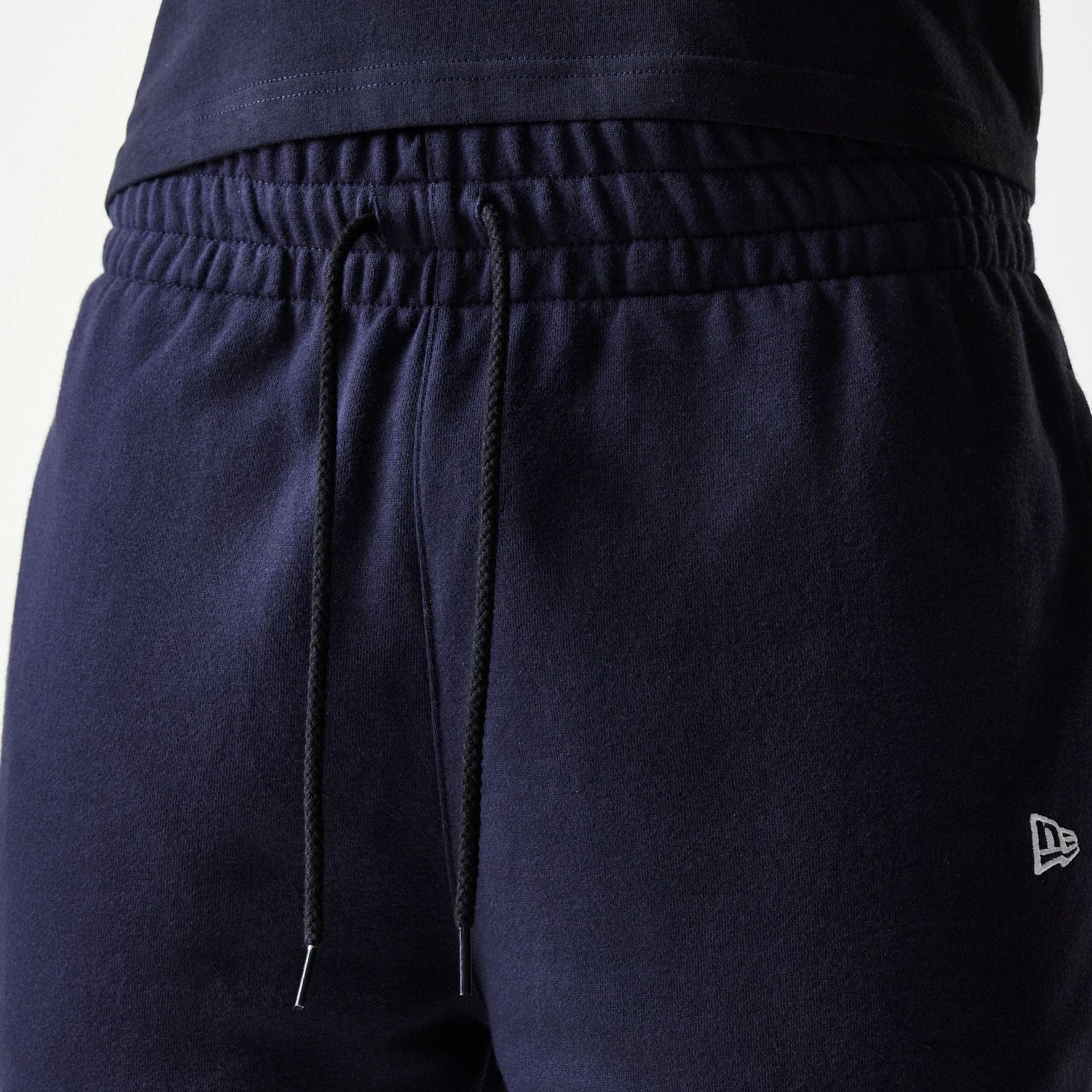 The Male model is wearing New York Yankees MLB League Essential Navy Shorts 6