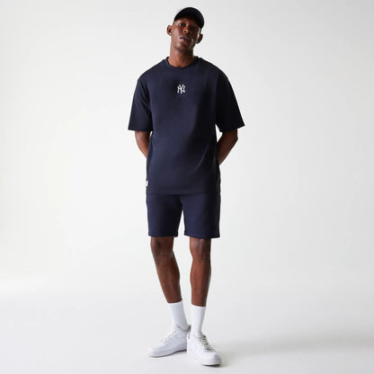 The Male model is wearing New York Yankees MLB League Essential Navy Shorts 8