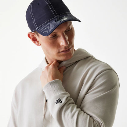 The Male model is wearing New York Yankees MLB League Essential Midi Cream Oversized Pullover Hoodie 4