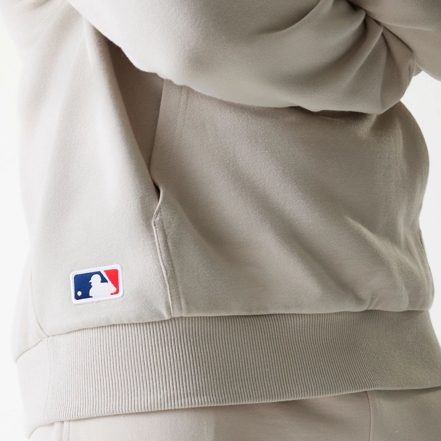 The Male model is wearing New York Yankees MLB League Essential Midi Cream Oversized Pullover Hoodie 6