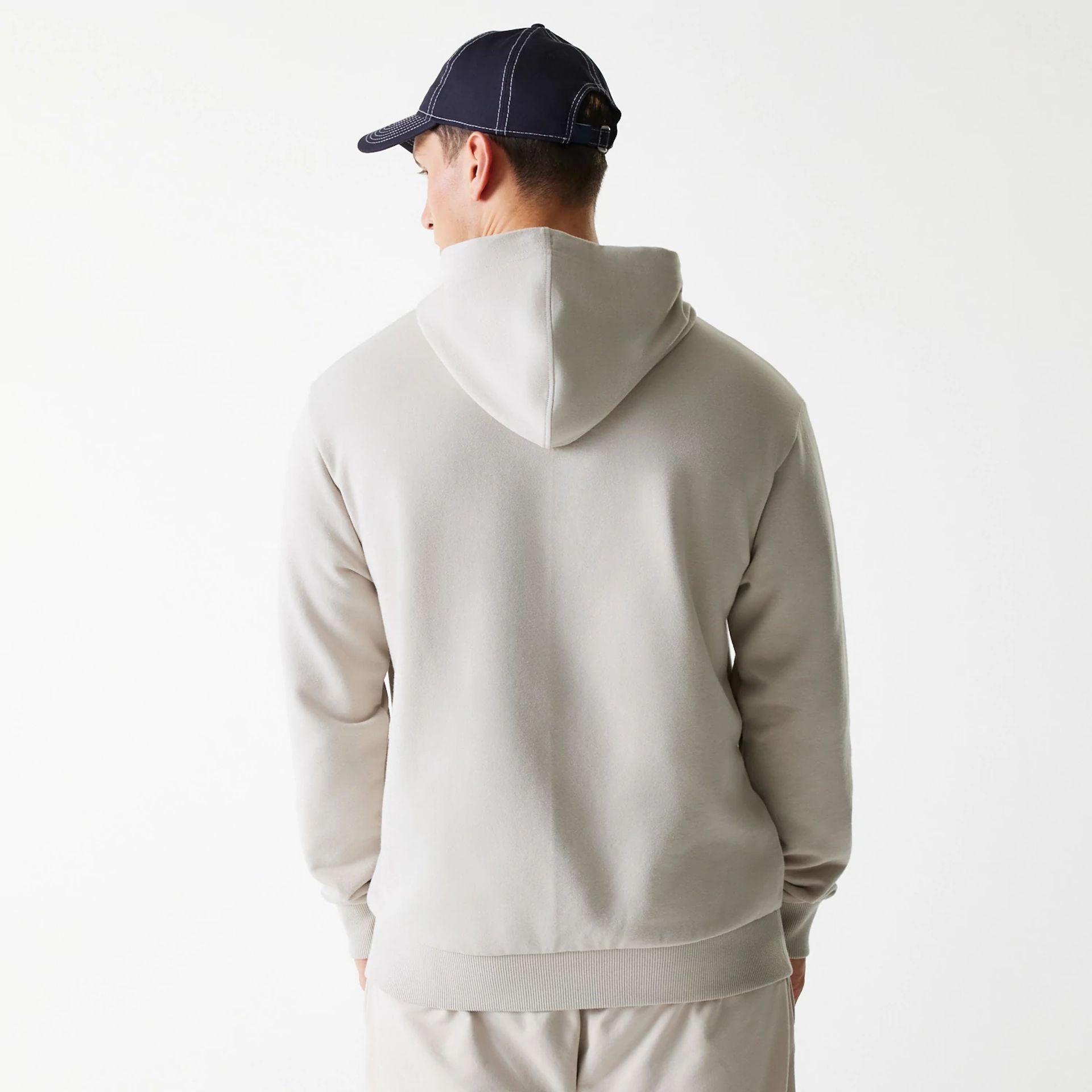 The Male model is wearing New York Yankees MLB League Essential Midi Cream Oversized Pullover Hoodie 2