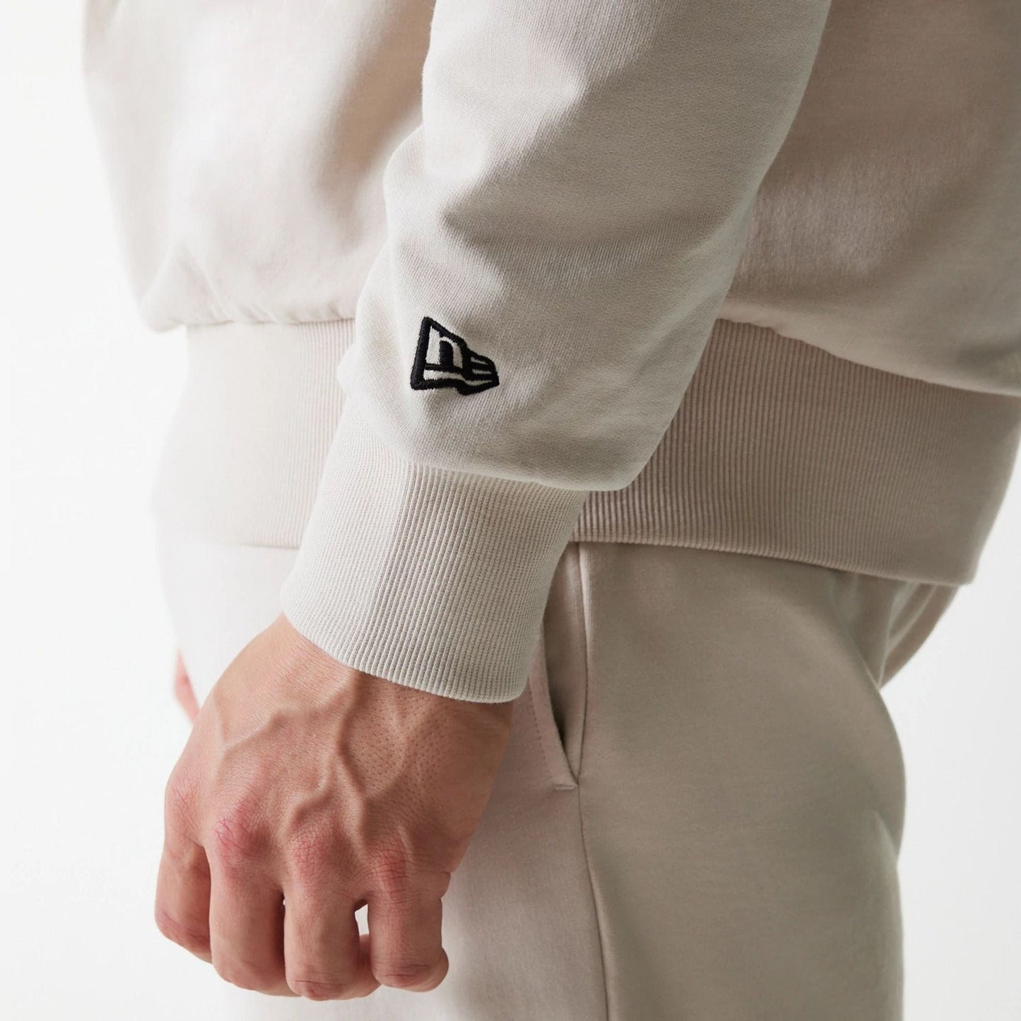 The Male model is wearing New York Yankees MLB League Essential Cream Crew Neck Sweater 5