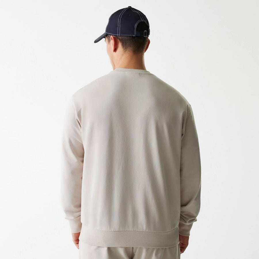 The Male model is wearing New York Yankees MLB League Essential Cream Crew Neck Sweater 2