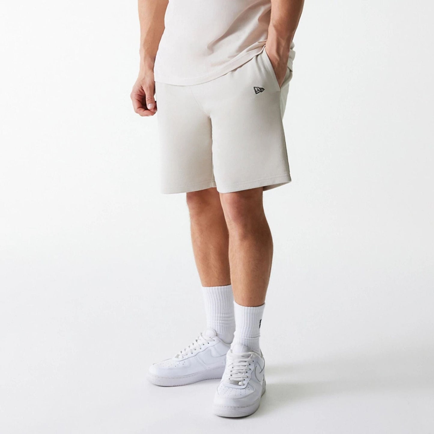 The Male model is wearing New York Yankees MLB League Essential Cream Shorts 7