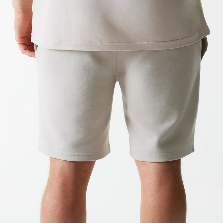 The Male model is wearing New York Yankees MLB League Essential Cream Shorts 6