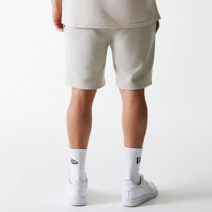 The Male model is wearing New York Yankees MLB League Essential Cream Shorts 2