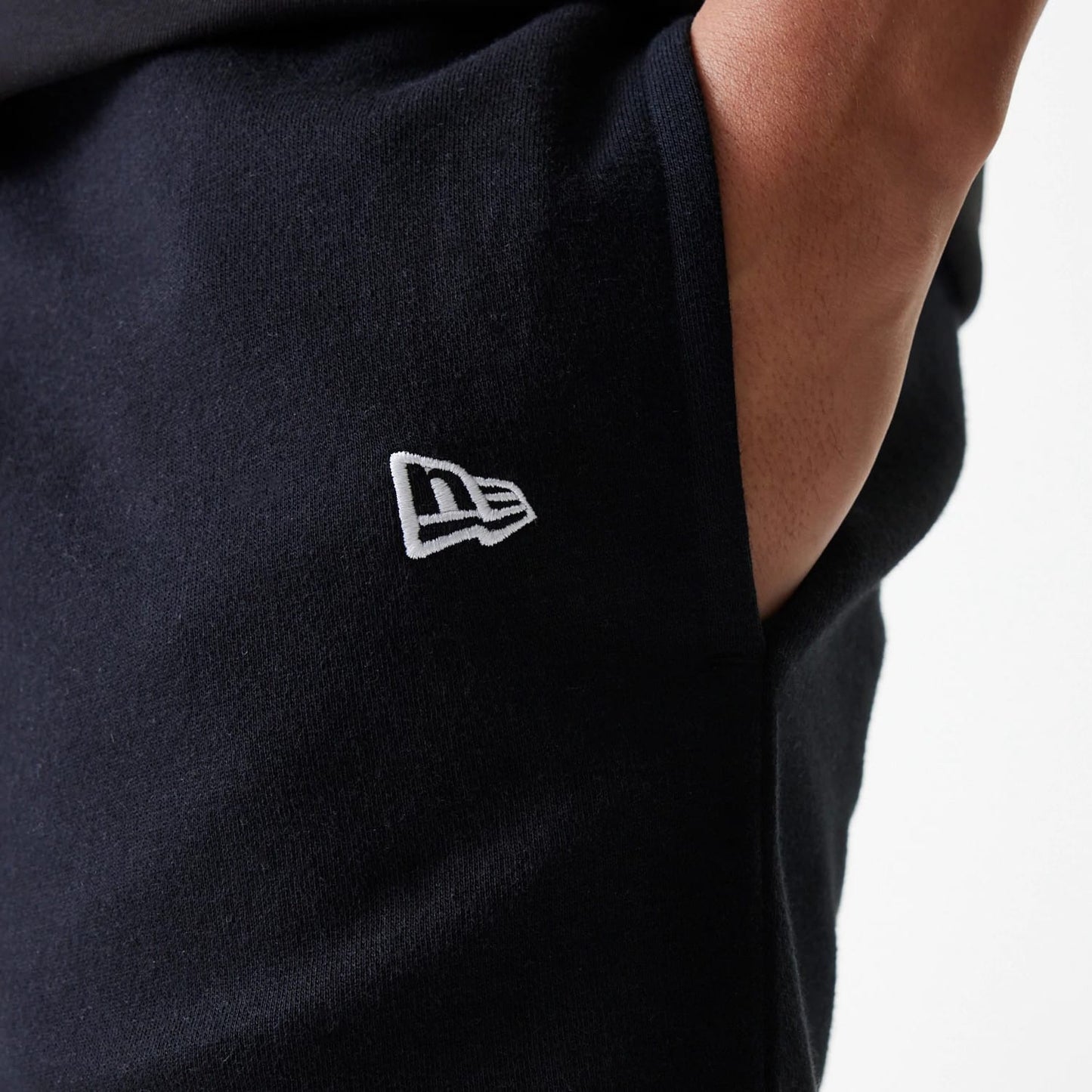 The Male model is wearing New York Yankees MLB League Essential Black Shorts 5