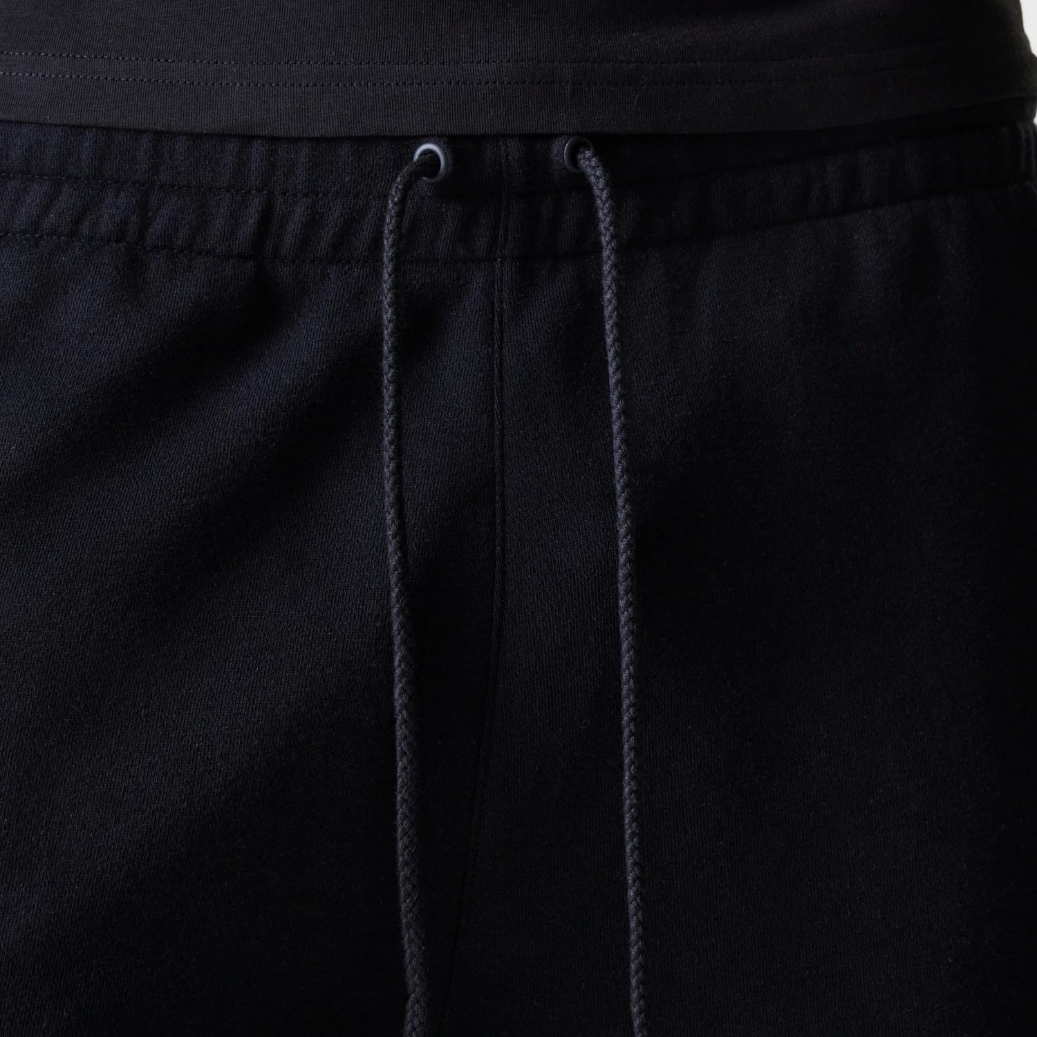 The Male model is wearing New York Yankees MLB League Essential Black Shorts 6