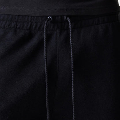 The Male model is wearing New York Yankees MLB League Essential Black Shorts 6