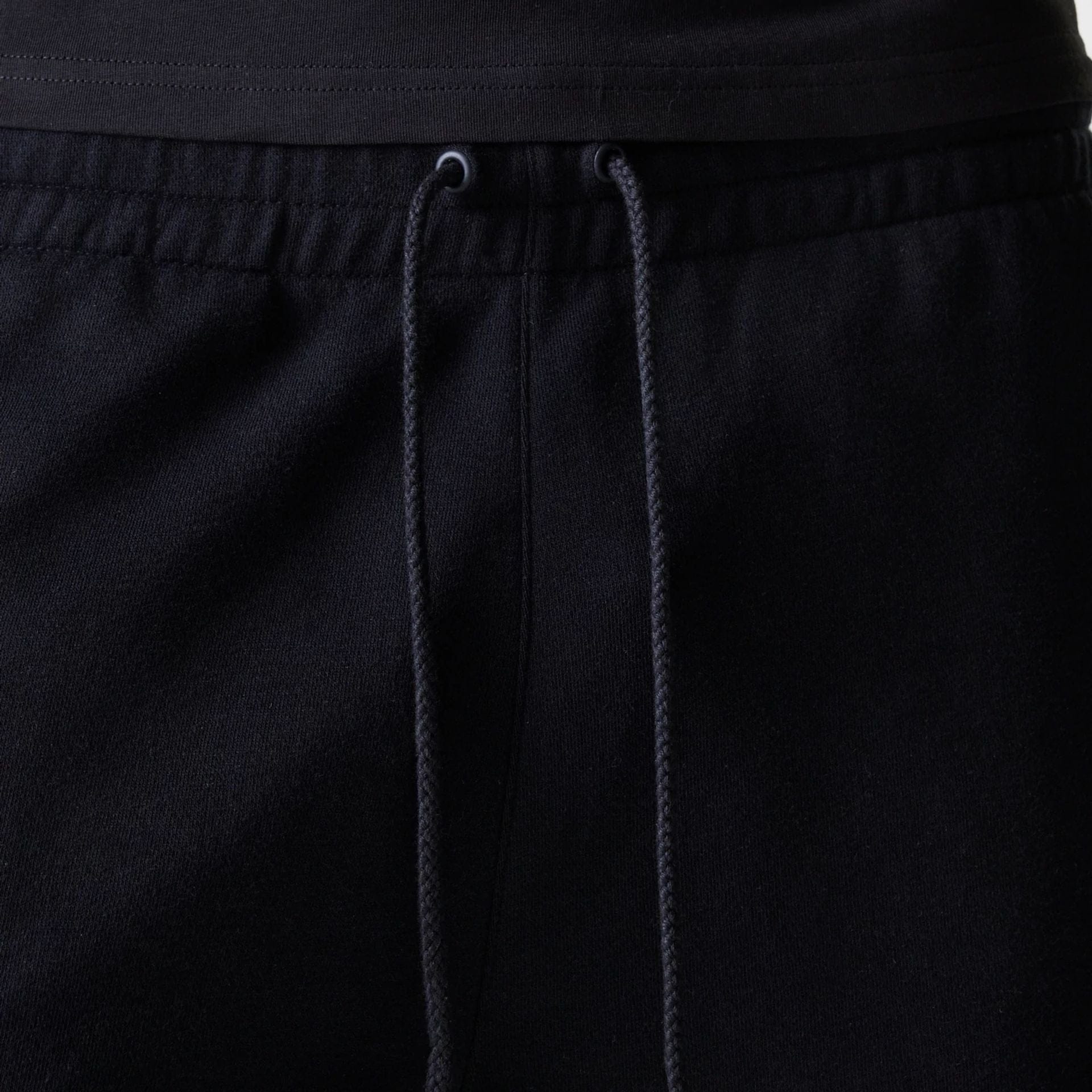 The Male model is wearing New York Yankees MLB League Essential Black Shorts 6