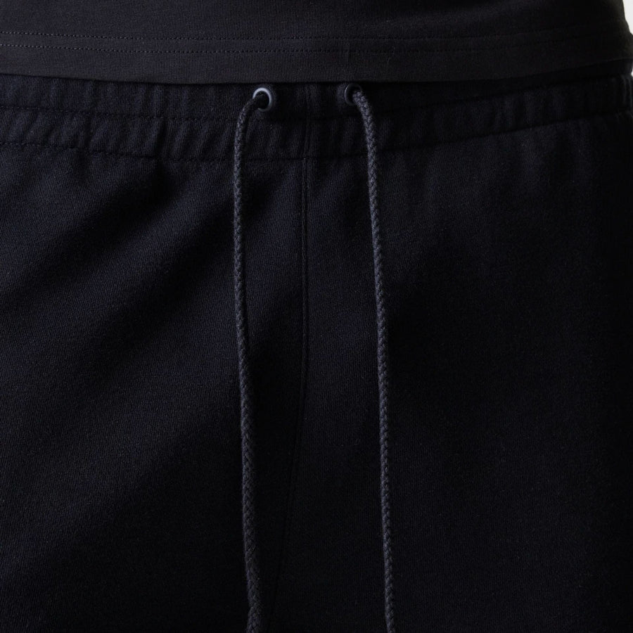 The Male model is wearing New York Yankees MLB League Essential Black Shorts 6