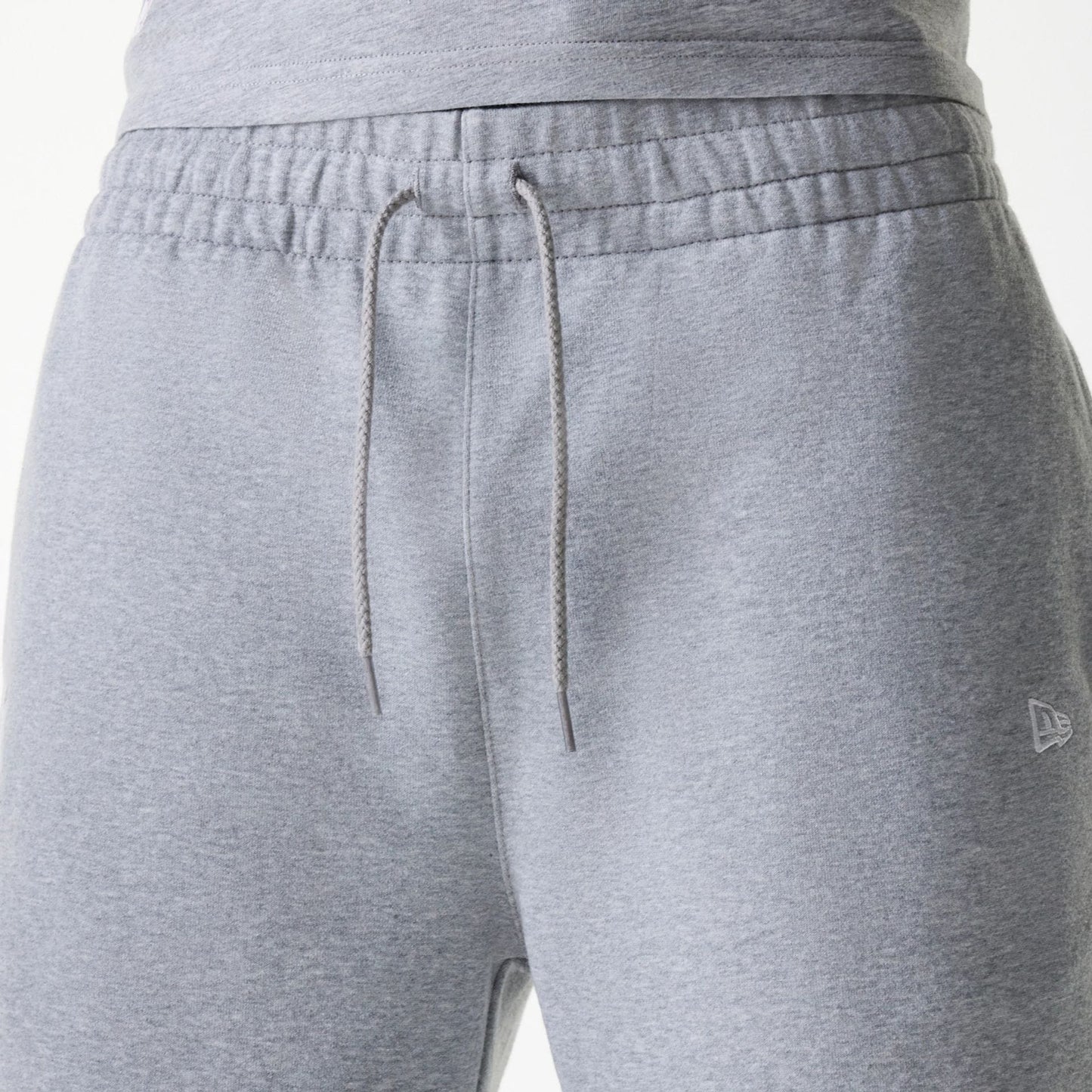 The Male model is wearing New York Yankees MLB League Essential Grey Shorts 6