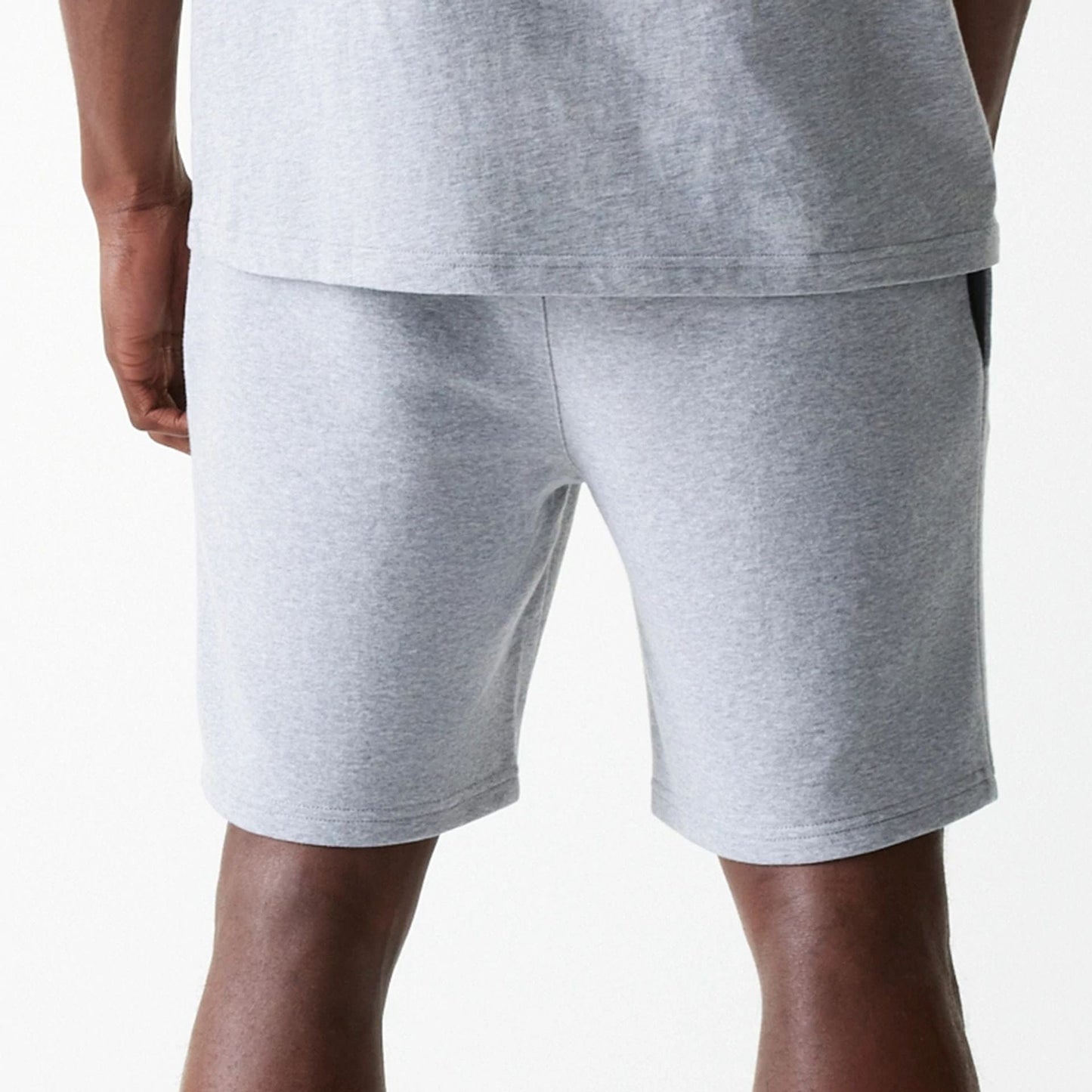 The Male model is wearing New York Yankees MLB League Essential Grey Shorts 7