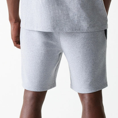 The Male model is wearing New York Yankees MLB League Essential Grey Shorts 7