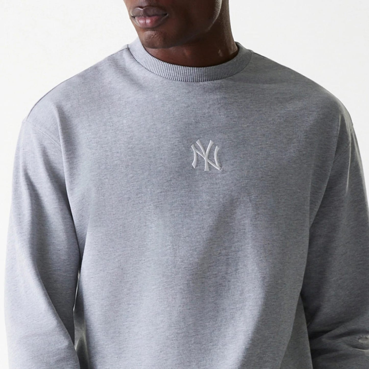 The Male model is wearing New York Yankees MLB League Essential Grey Crew Neck Sweater. 6