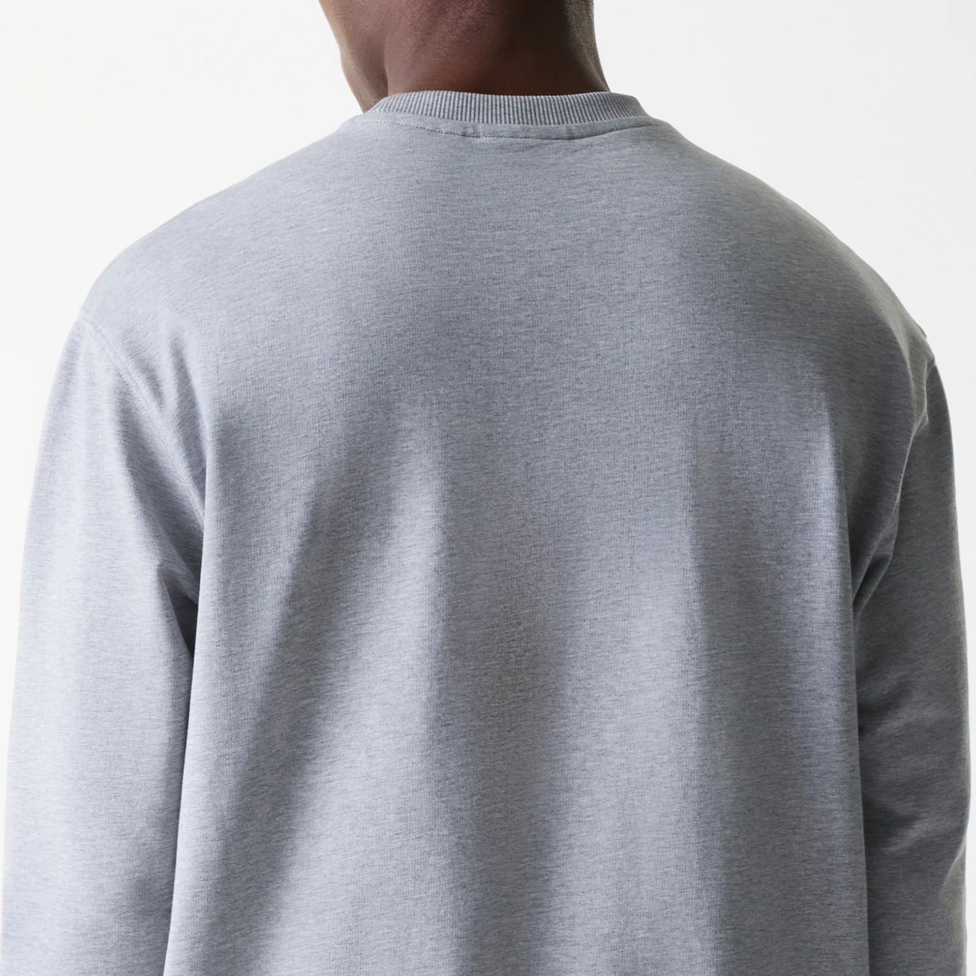 The Male model is wearing New York Yankees MLB League Essential Grey Crew Neck Sweater. 7