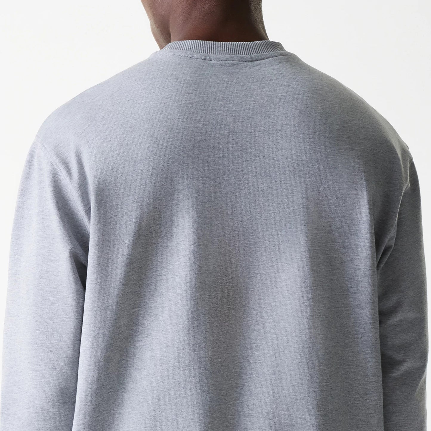 The Male model is wearing New York Yankees MLB League Essential Grey Crew Neck Sweater. 7