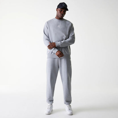 The Male model is wearing New York Yankees MLB League Essential Grey Crew Neck Sweater. 8