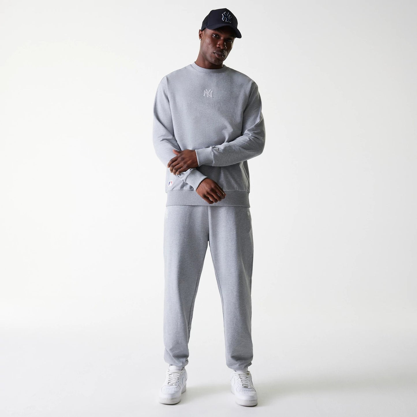 The Male model is wearing New York Yankees MLB League Essential Grey Crew Neck Sweater. 8