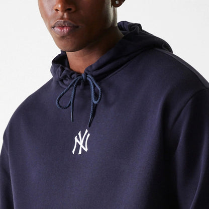 The Male model is wearing New York Yankees MLB League Essential Midi Navy Oversized Pullover Hoodie 4