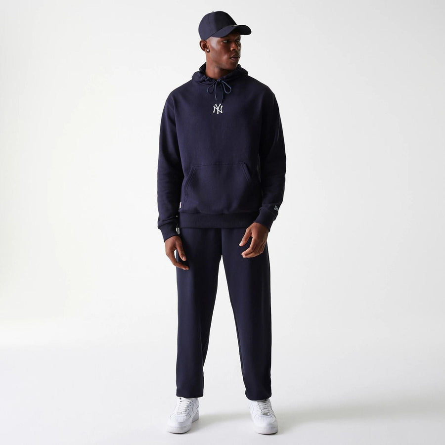 The Male model is wearing New York Yankees MLB League Essential Midi Navy Oversized Pullover Hoodie 8