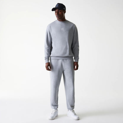 The Male model is wearing New York Yankees MLB League Essential Midi Grey Joggers 8