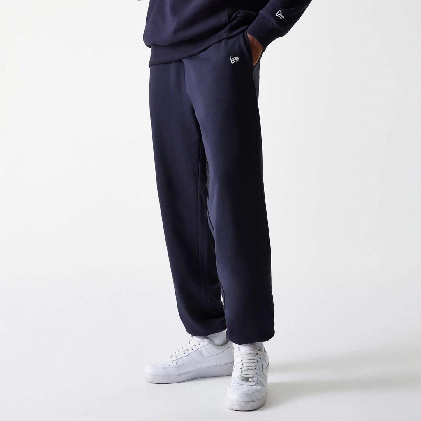 The Male model is wearing New York Yankees MLB League Essential Midi Navy Joggers 1