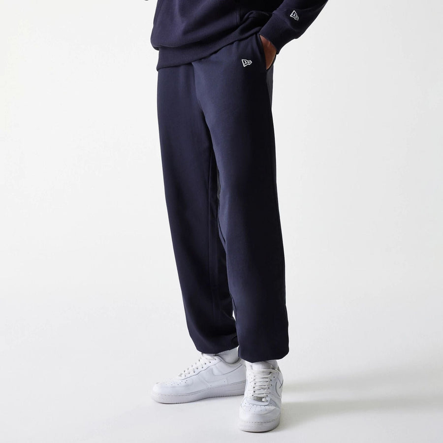 The Male model is wearing New York Yankees MLB League Essential Midi Navy Joggers 1