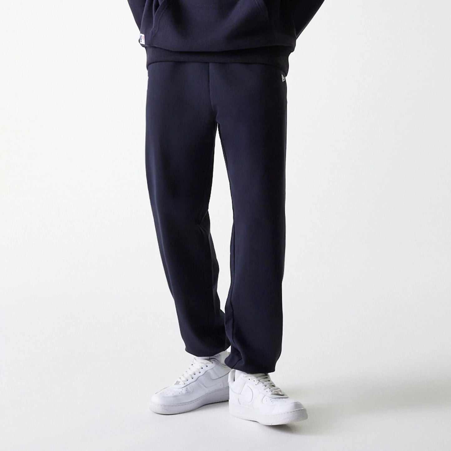 The Male model is wearing New York Yankees MLB League Essential Midi Navy Joggers 3