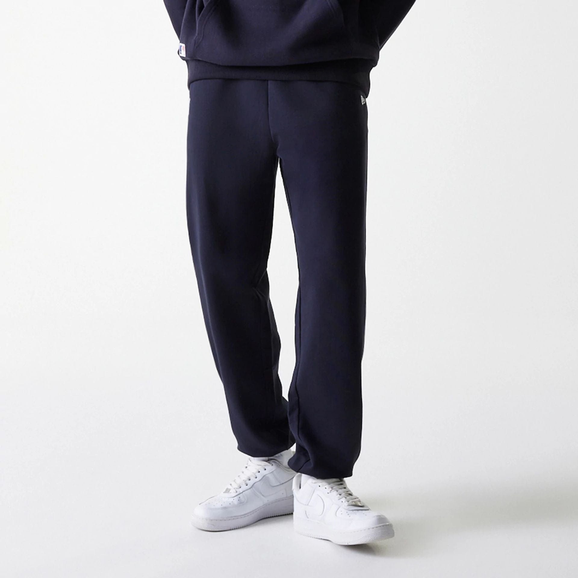 The Male model is wearing New York Yankees MLB League Essential Midi Navy Joggers 3