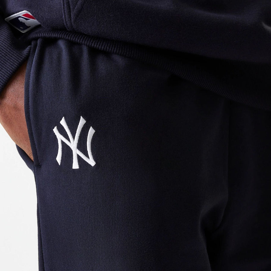 The Male model is wearing New York Yankees MLB League Essential Midi Navy Joggers 4