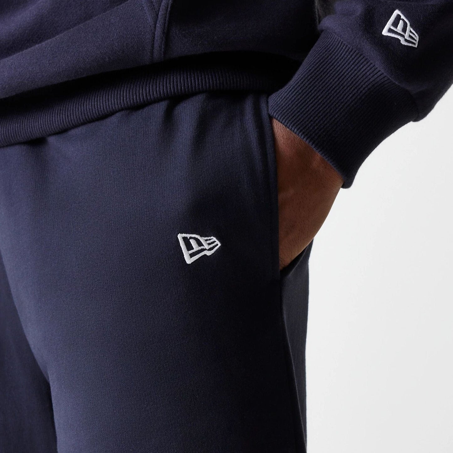 The Male model is wearing New York Yankees MLB League Essential Midi Navy Joggers 5