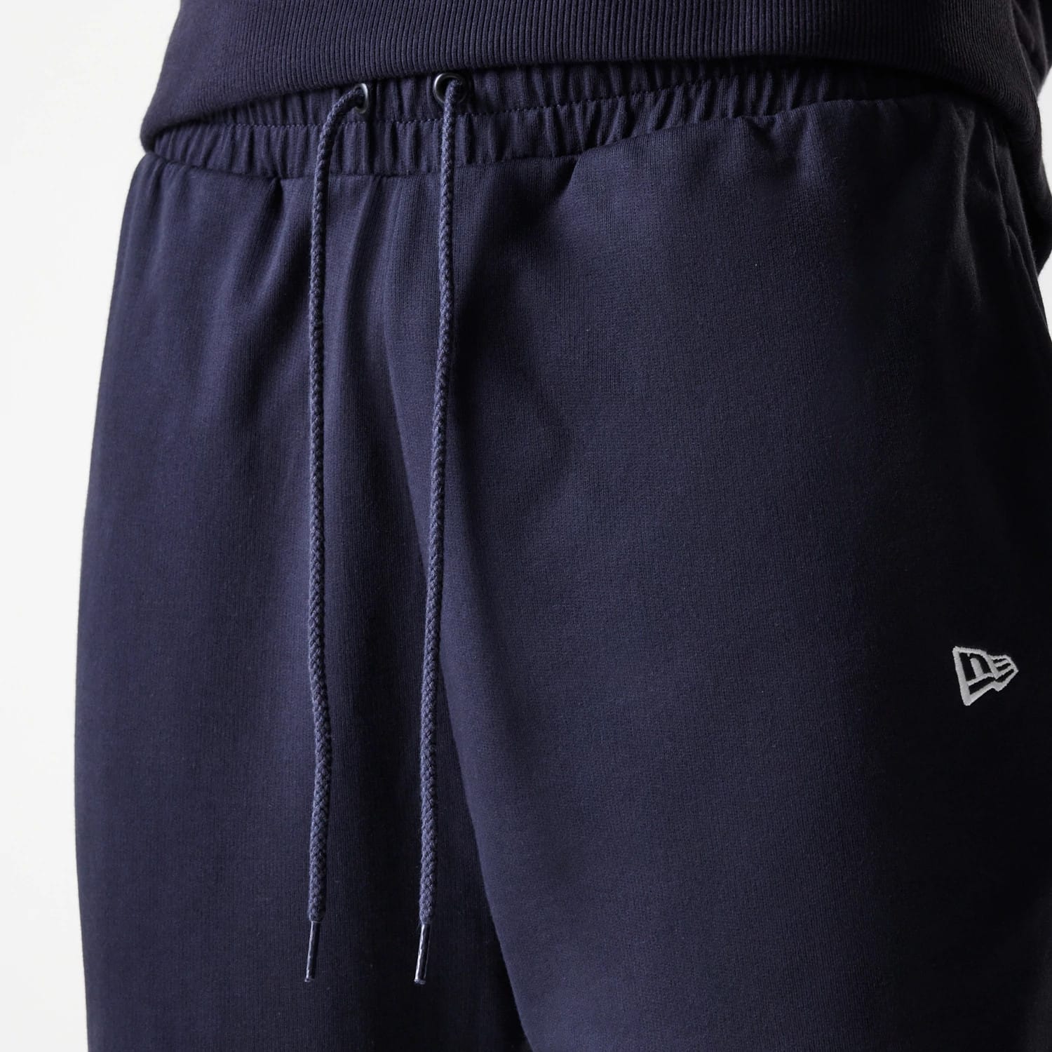 The Male model is wearing New York Yankees MLB League Essential Midi Navy Joggers 6