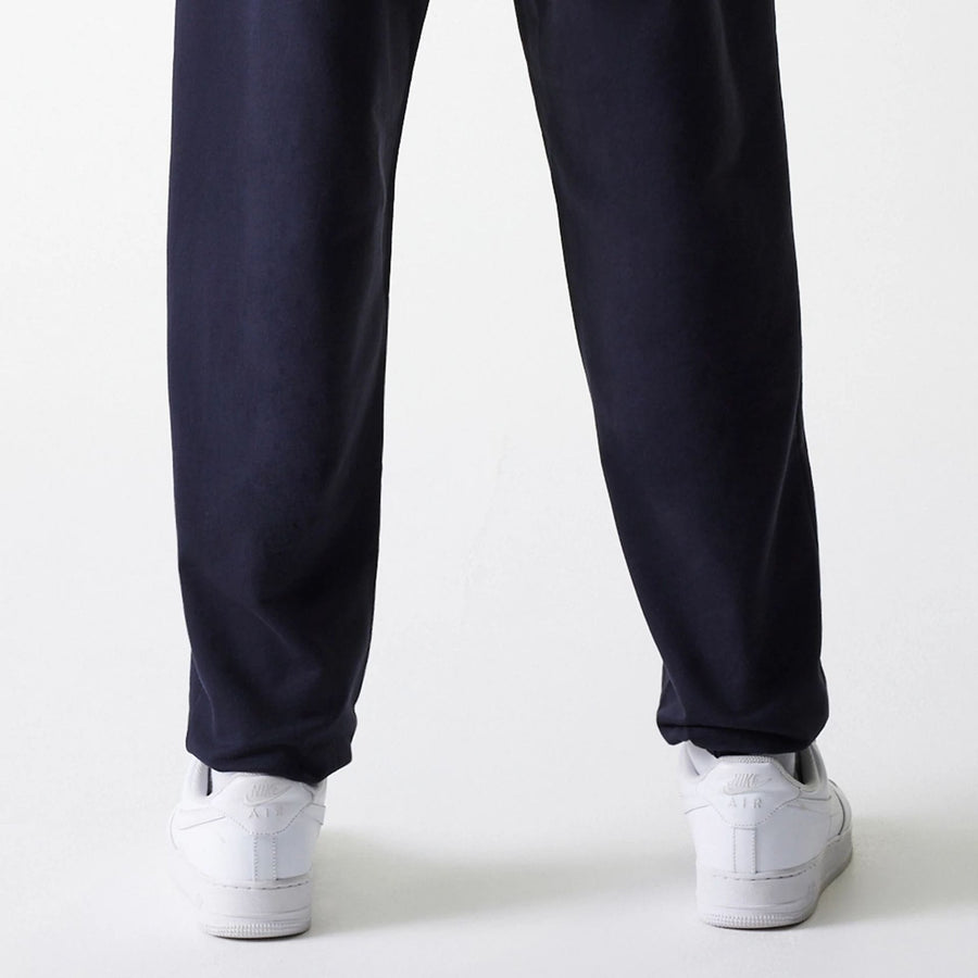 The Male model is wearing New York Yankees MLB League Essential Midi Navy Joggers 7