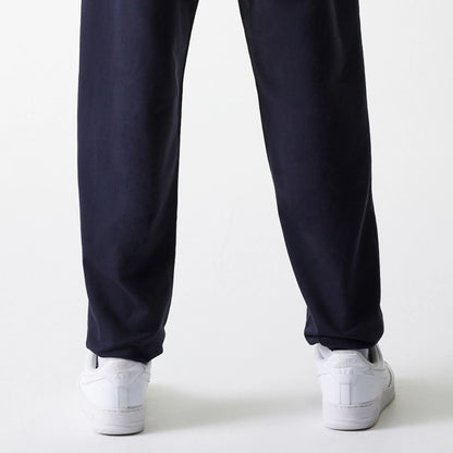 The Male model is wearing New York Yankees MLB League Essential Midi Navy Joggers 7