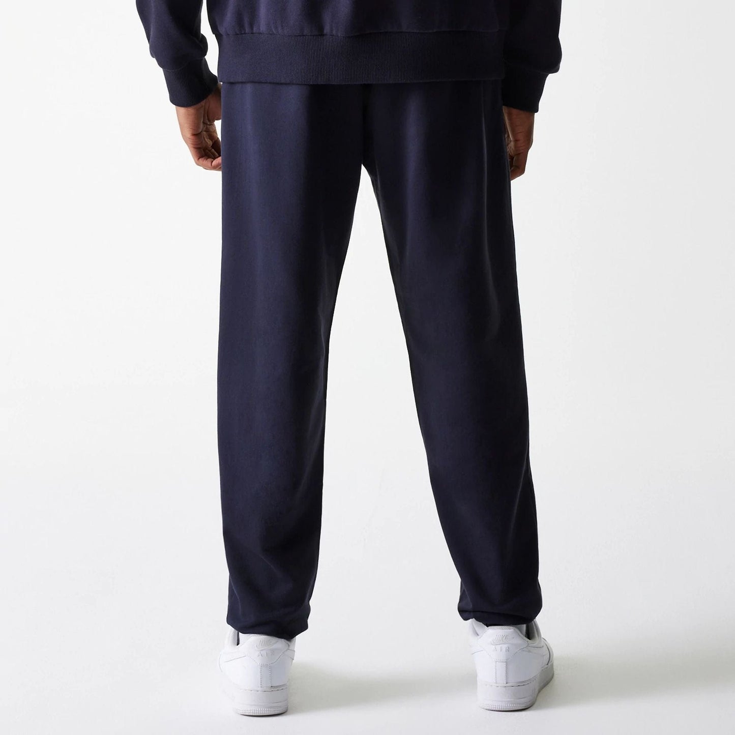 The Male model is wearing New York Yankees MLB League Essential Midi Navy Joggers 2