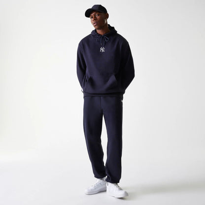 The Male model is wearing New York Yankees MLB League Essential Midi Navy Joggers 8